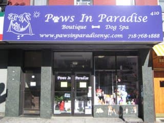 Paws in Paradise storefront and team